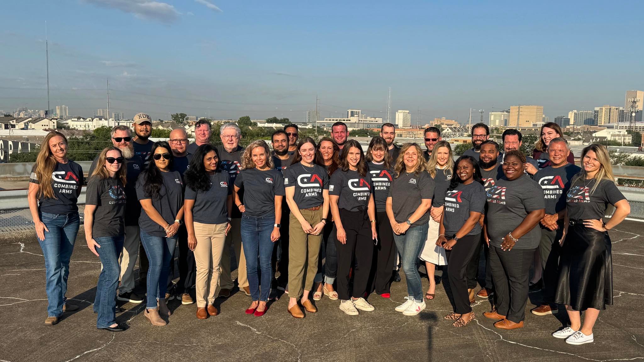 Combined Arms staff pose for a photo in Houston.